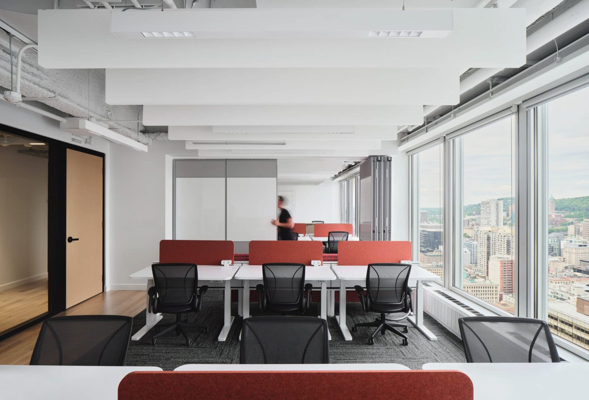 TechoLED BX-3L direct linear LED pendant fixture in modern office. White option.