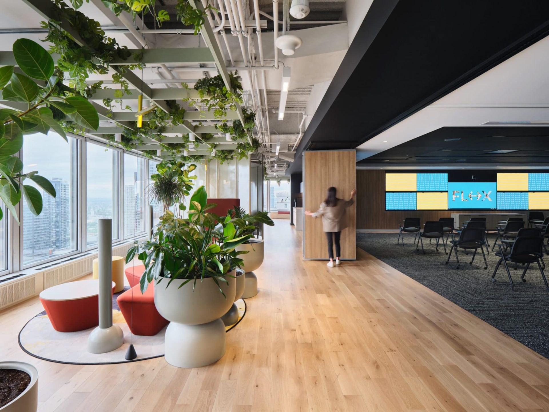TechoLED BX-3L direct linear LED pendant fixture in modern office. White option.