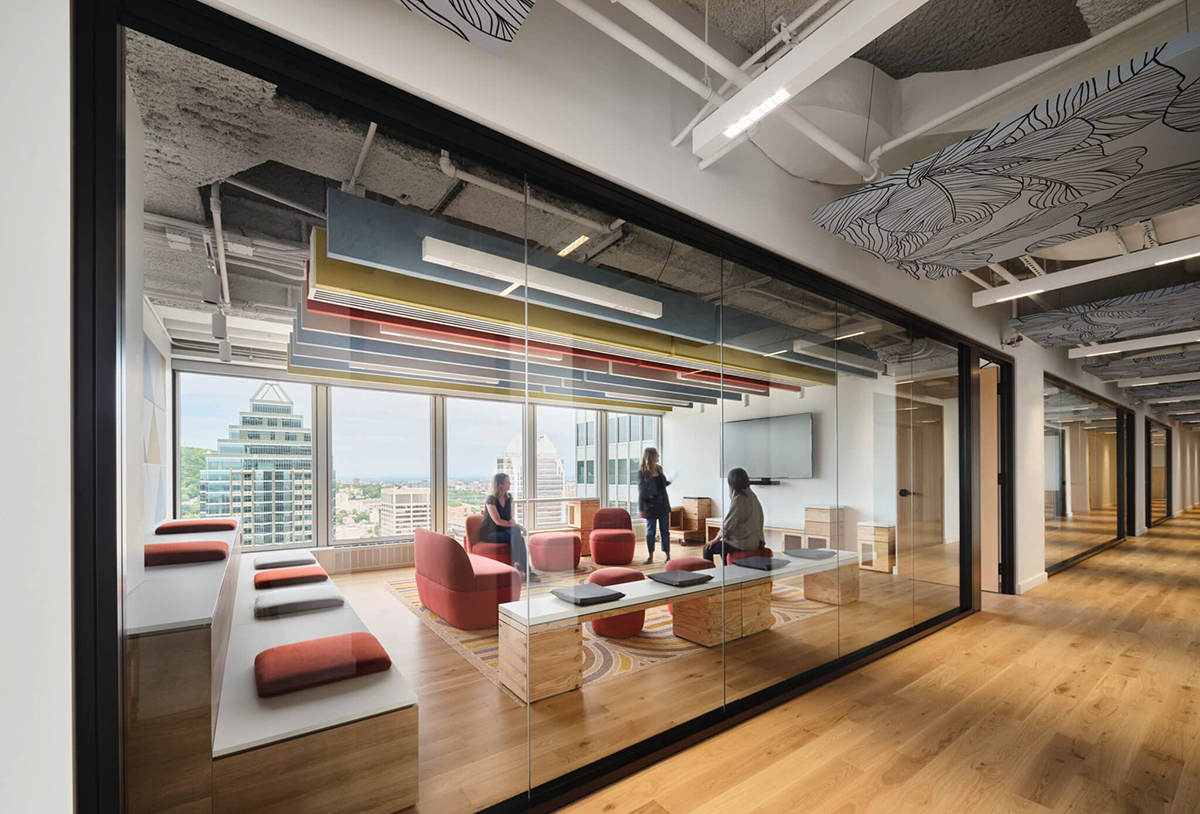 TechoLED BX-3L direct linear LED pendant fixture in modern office. White option.