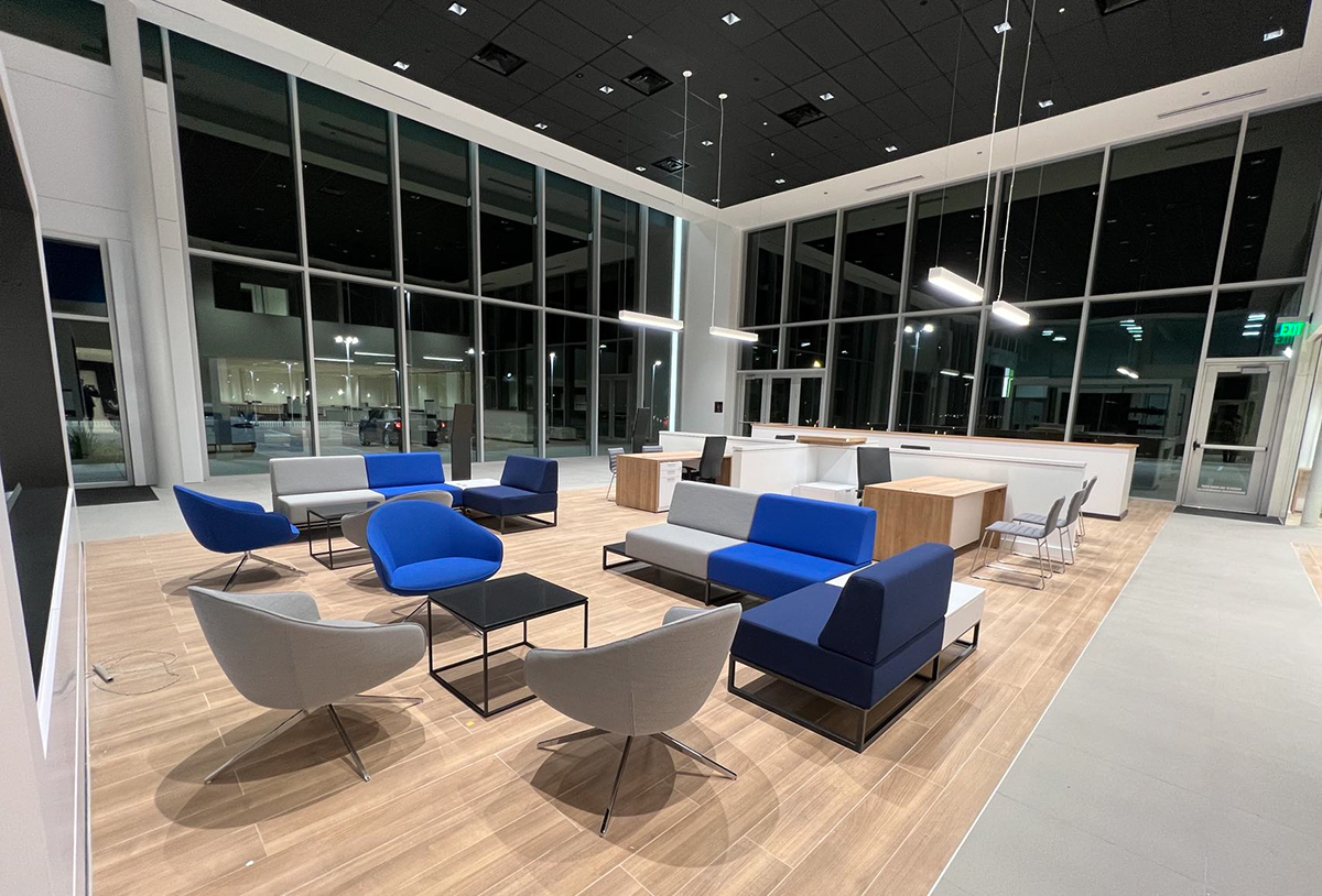 TechoLED BX-4 direct linear LED pendant fixture in modern office. White option.