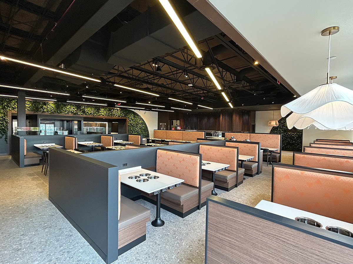 TechoLED BX-4 direct linear LED pendant fixture in restaurant. Black option.