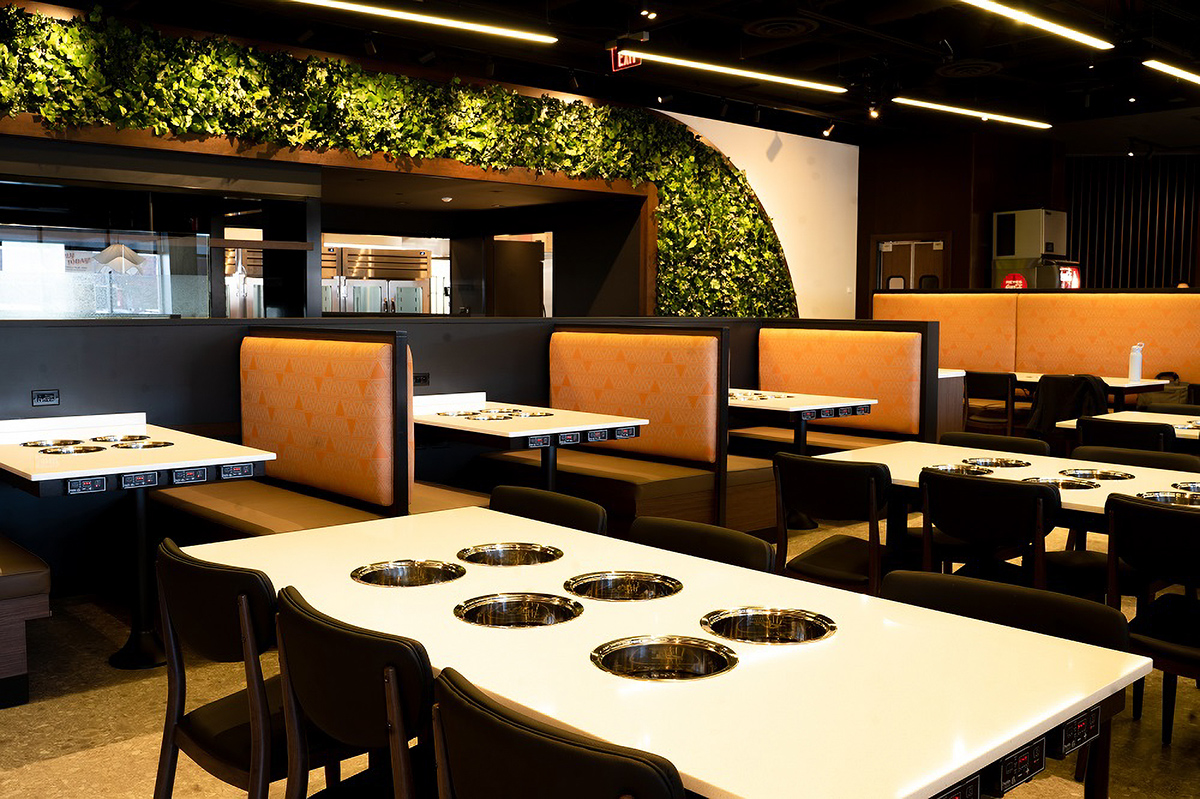 TechoLED BX-4 direct linear LED pendant fixture in restaurant. Black option.